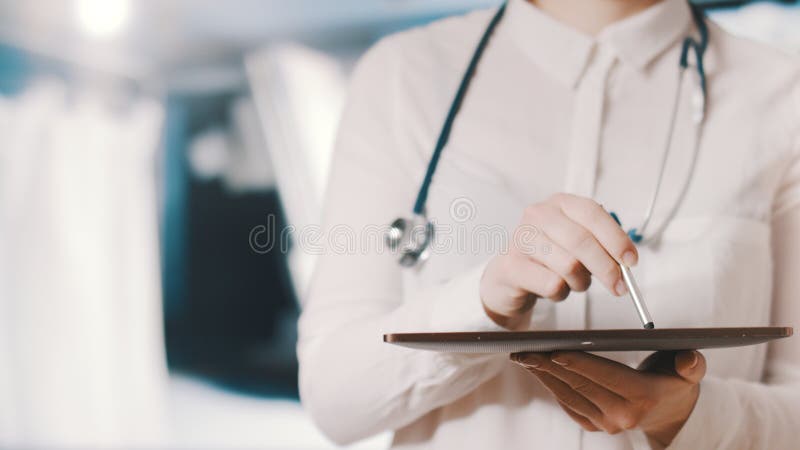 Healthcare and technology. Doctor working on digital tablet in hospital. Healthcare and technology. Doctor working on a digital tablet in hospital. Healthcare royalty free stock image Healthcare and technology. Doctor working on digital tablet in hospital. Healthcare and technology. Doctor working on a digital tablet in hospital. Healthcare royalty free stock image