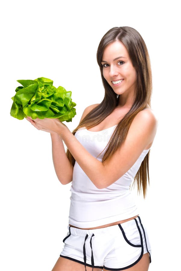 Healthful eating-Beautiful fit woman holding a salad imagens de stock royalty free Healthful eating-Beautiful fit woman holding a salad imagens de stock royalty free