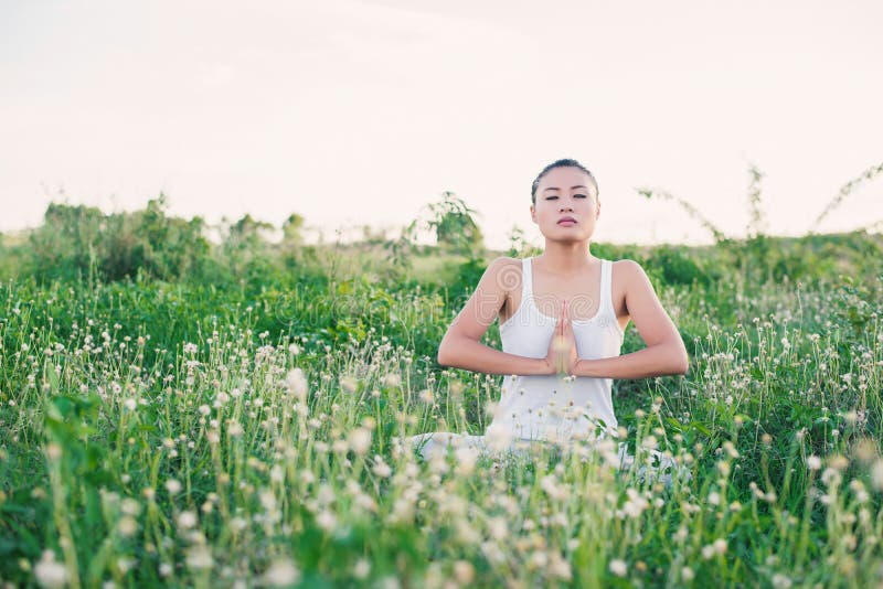Healthy and beautiful young yoga woman sitting with joined hand royalty free stock photos Healthy and beautiful young yoga woman sitting with joined hand royalty free stock photos