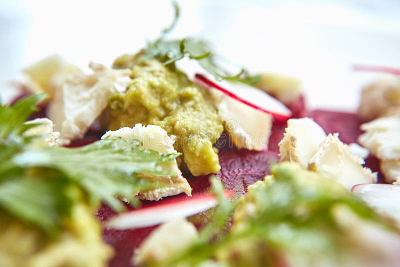 Healthy Beet Salad with fresh sweet baby spinach, kale lettuce, nuts, feta cheese and toast melted.