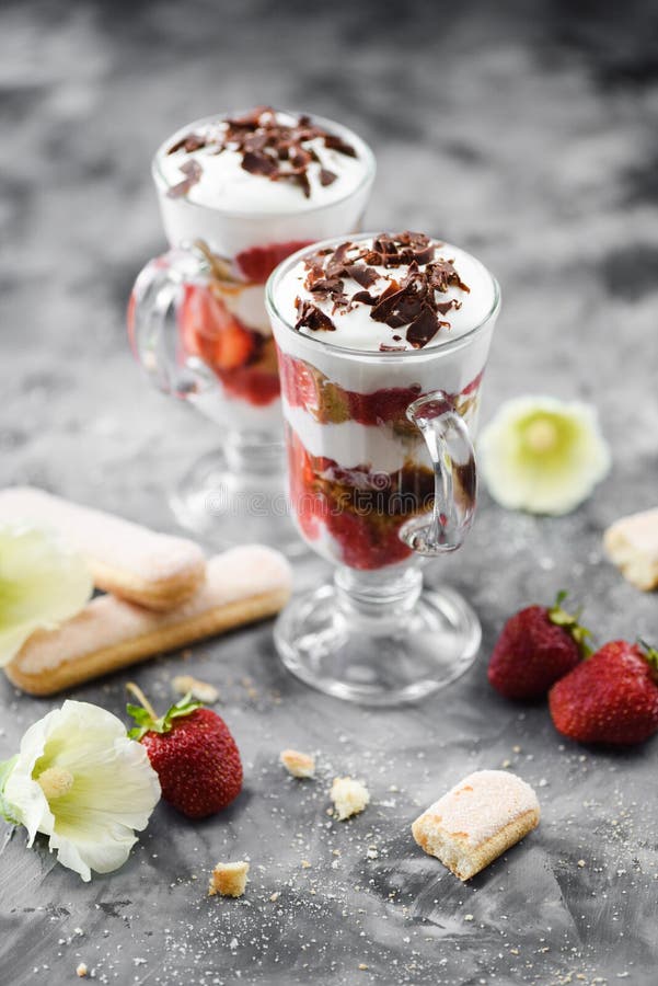 Healthy berry dessert. Strawberry trifle with strawberries, whipped cream and bisquits in glasses royalty free stock photos Healthy berry dessert. Strawberry trifle with strawberries, whipped cream and bisquits in glasses royalty free stock photos