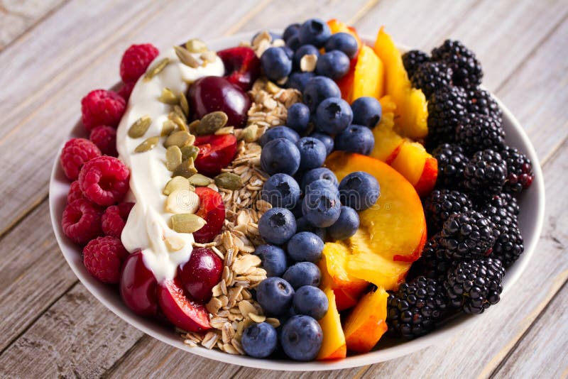Healthy breakfast bowl - berries, muesli, fruits, yogurt and sunflower seeds. Healthy detox morning meal. royalty free stock image Healthy breakfast bowl - berries, muesli, fruits, yogurt and sunflower seeds. Healthy detox morning meal. royalty free stock image