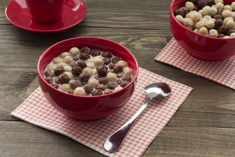 A healthy breakfast cereal balls with milk and coffee for two royalty free stock image