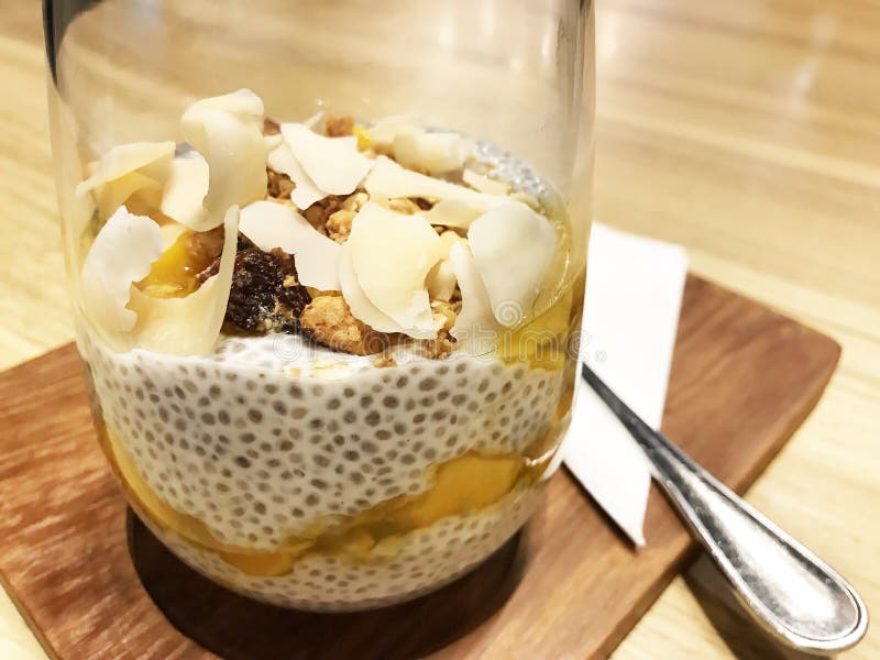 Healthy Breakfast. Chia Seed Pudding with Mango and Roasted Coconut