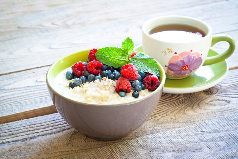 Healthy breakfast - oatmeal with berries stock photos