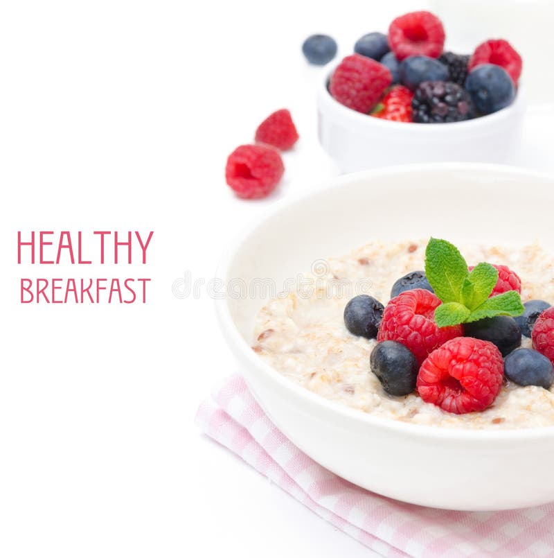 Healthy breakfast - oatmeal with fresh berries isolated on white