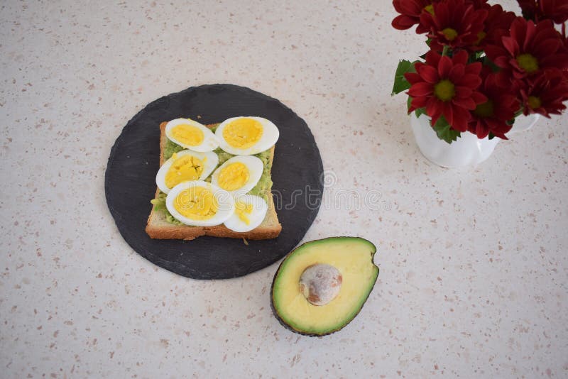 Healthy Breakfast Toast with Egg, Avocado and Herbs Stock Image - Image