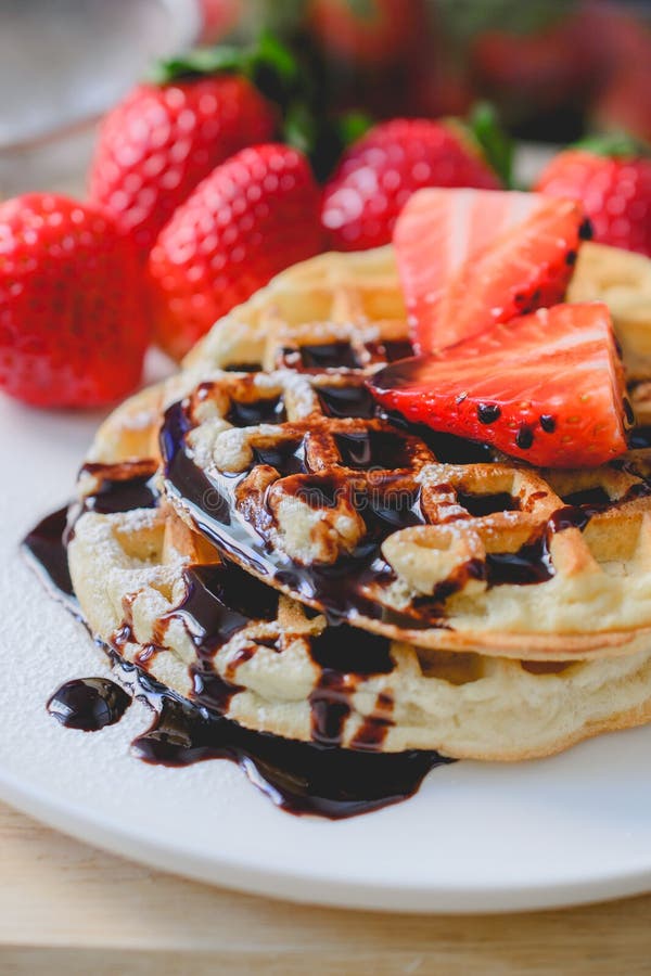 Healthy Breakfast Waffle with Strawberry and Chocolate Syrup on Stock