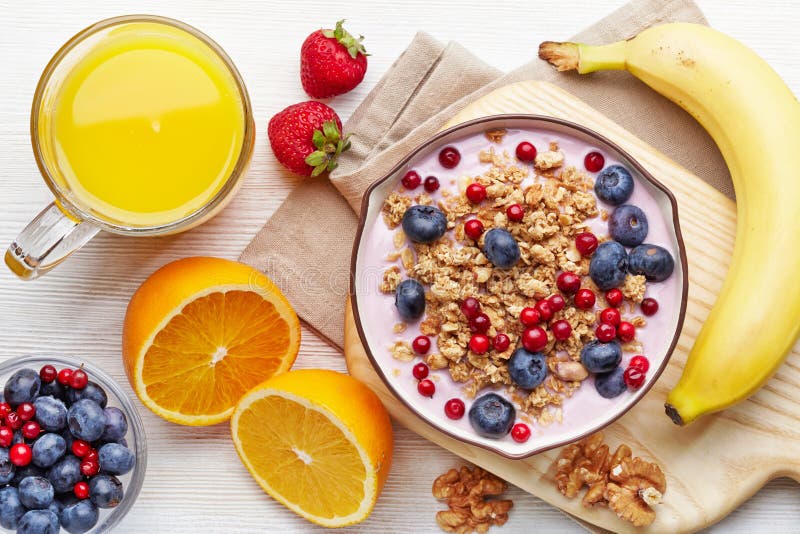 Healthy breakfast. Yogurt with granola and berries royalty free stock images