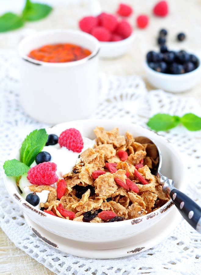 Healthy Breakfast, Yogurt with Granola and Berries on the White Table