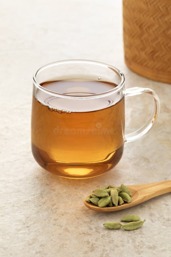 Healthy Cardamom Tea with a Spoon Cardamom Pods in Front Stock Image
