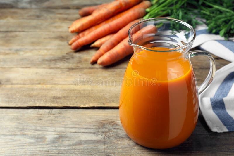 Healthy Carrot Juice on Wooden Table. Space for Text Stock Image