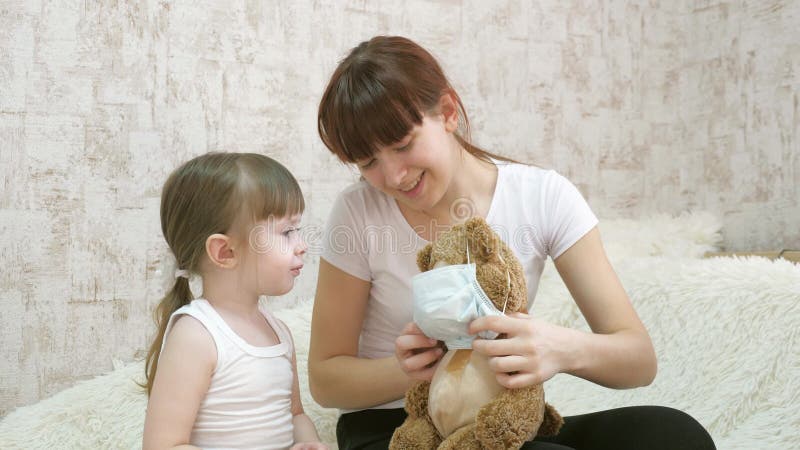 Healthy Children Play in Hospital. Little Child Girl in Quarantine Putting on Medical Mask on a Toy Bear. Protection Stock Video - Video of hospital, doctor: 178741557