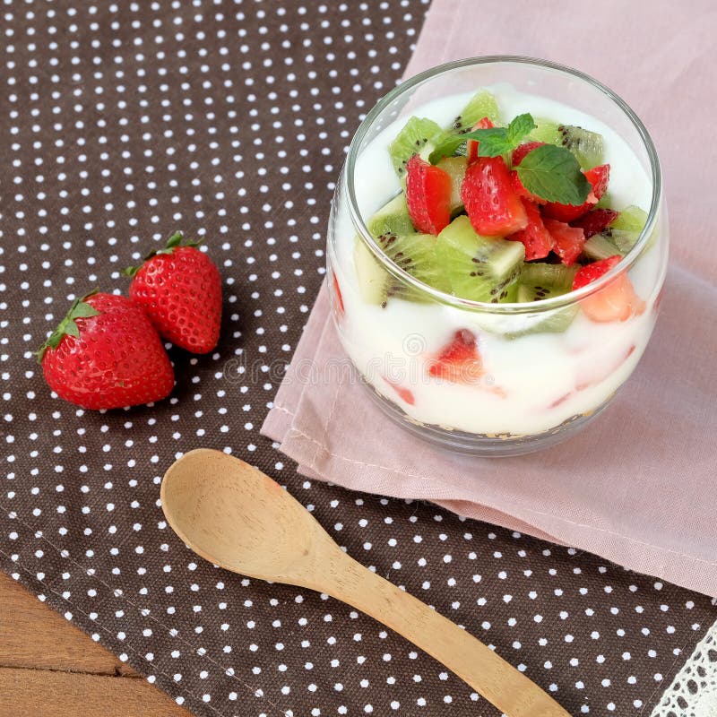 Healthy and colorful breakfast: Yoghurt with granola, strawberry and kiwi fruit