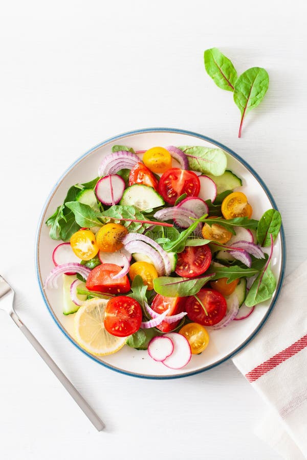 Healthy Colorful Vegan Tomato Salad With Cucumber, Radish, Onion Stock ...