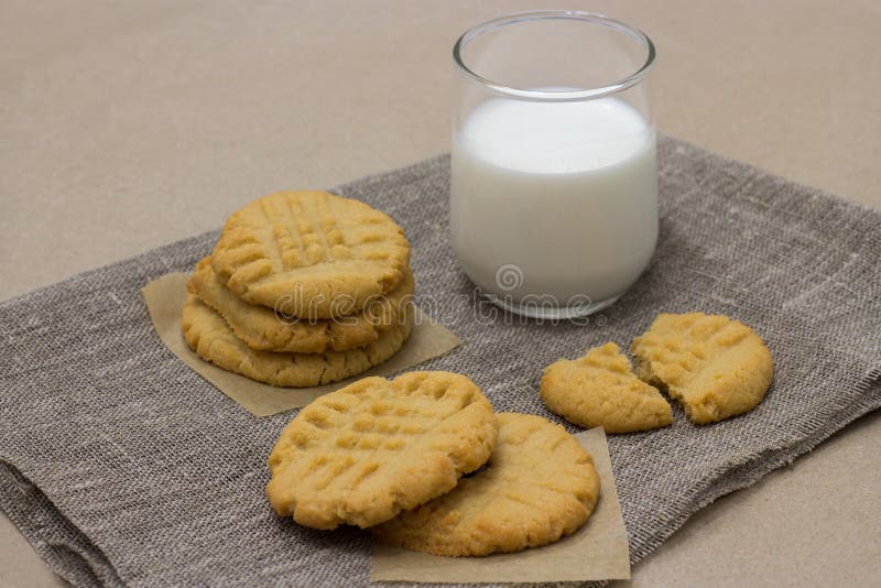 Healthy cookies from the peanut butter and milk on linen napkin stock image Healthy cookies from the peanut butter and milk on linen napkin stock image