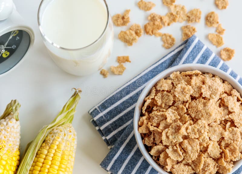 Healthy Corn Flakes with Milk for Breakfast on Table Stock Photo Image of clock, energy 112448898
