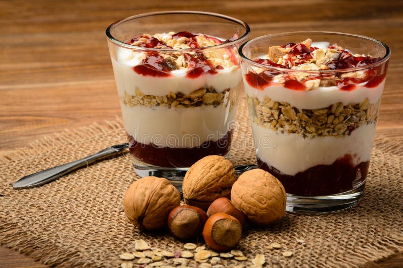 Healthy Dessert with Muesli, Nuts and Raspberry Jam. Stock Photo