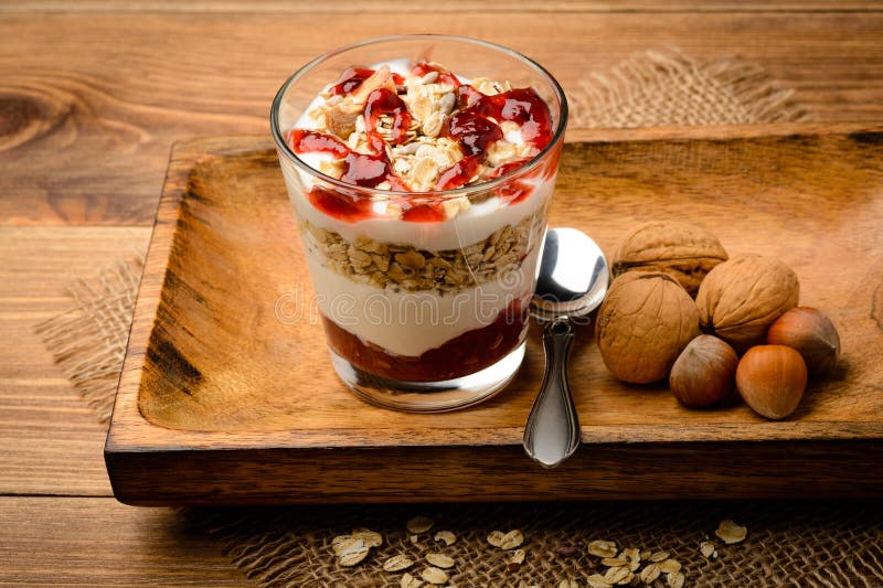 Healthy Dessert with Muesli, Nuts and Raspberry Jam. Stock Photo