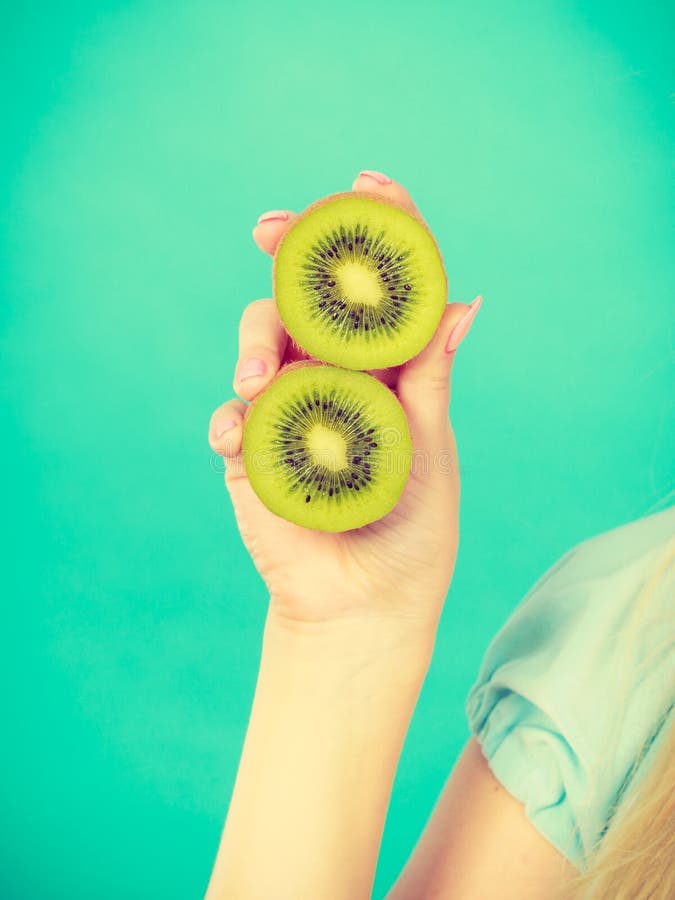 Woman Holding Green Kiwi Fruit Stock Image - Image of organic, fresh ...