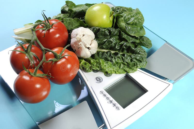 Healthy diet and weight loss concept with healthy vegetables and diet scale. royalty free stock image Healthy diet and weight loss concept with healthy vegetables and diet scale. royalty free stock image