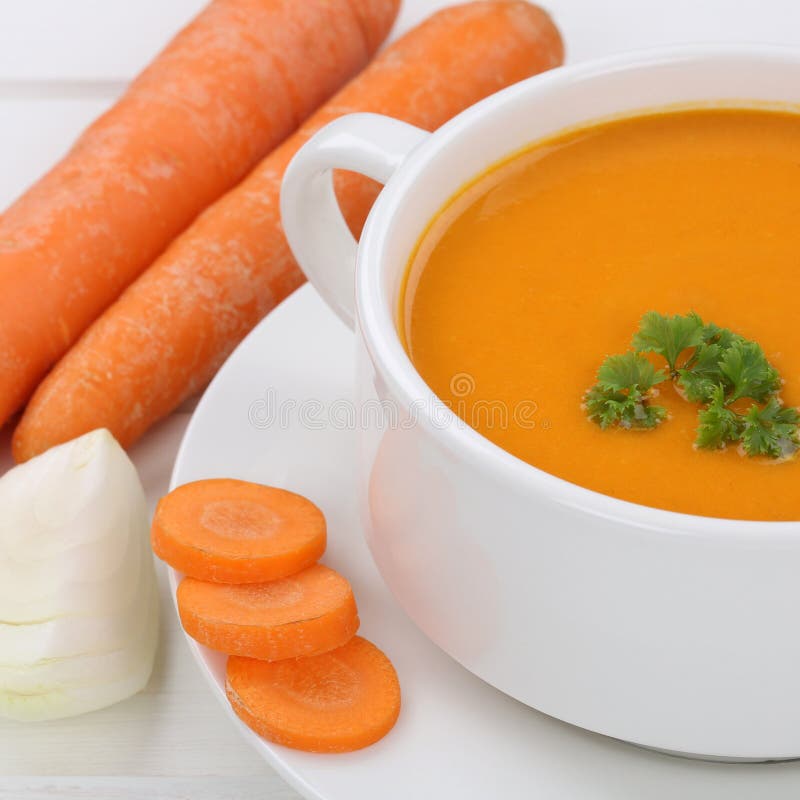 Healthy eating carrot soup with carrots in cup
