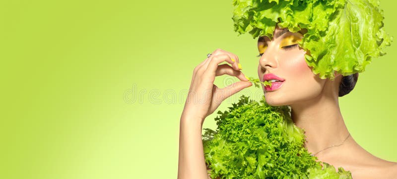 Healthy eating, diet. Beautiful healthy girl eating raw vegan food and smiling. Beauty young fashion woman eats green fresh lettuc