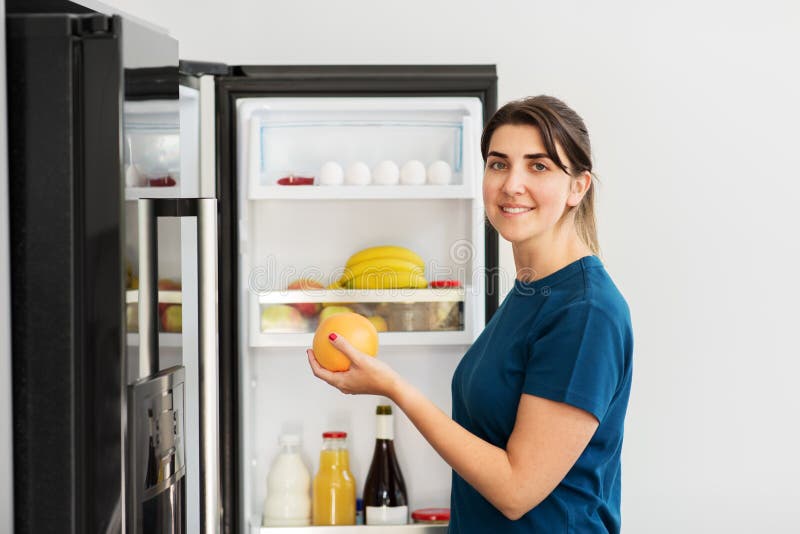 Happy Woman Taking Food from Fridge at Home Stock Image - Image of ...
