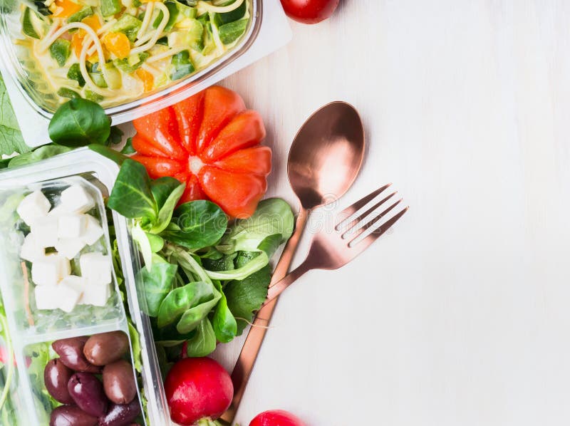 Healthy eating with salad and cutlery on white wooden background, top view. Clean and dieting food royalty free stock photo Healthy eating with salad and cutlery on white wooden background, top view. Clean and dieting food royalty free stock photo