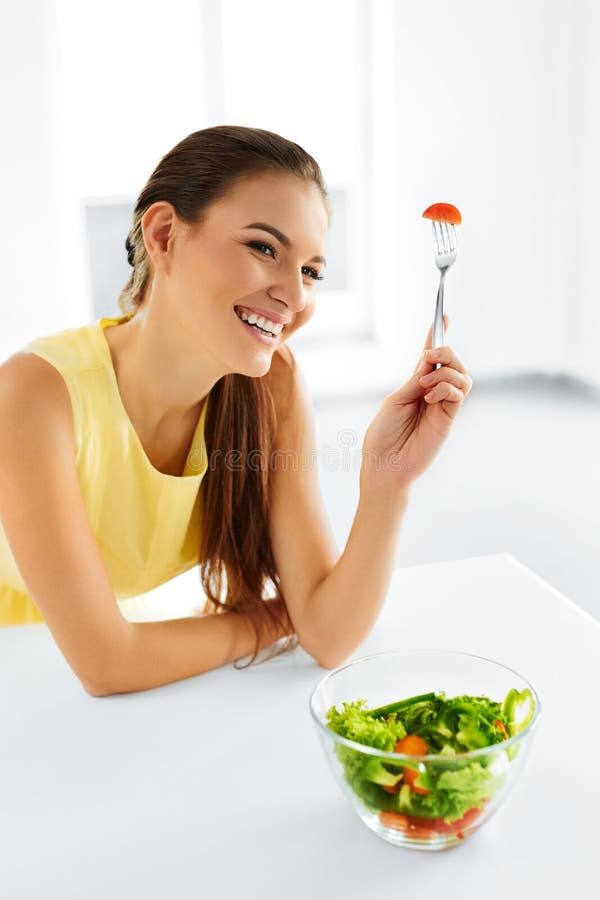 Healthy Eating. Vegetarian Woman Eating Salad. Food, Lifestyle, stock photo Healthy Eating. Vegetarian Woman Eating Salad. Food, Lifestyle, stock photo