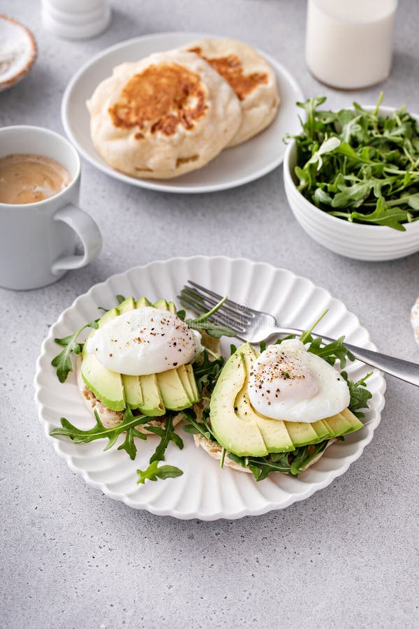 Healthy Egg Benedict with Avocado and Arugula Stock Image Image of
