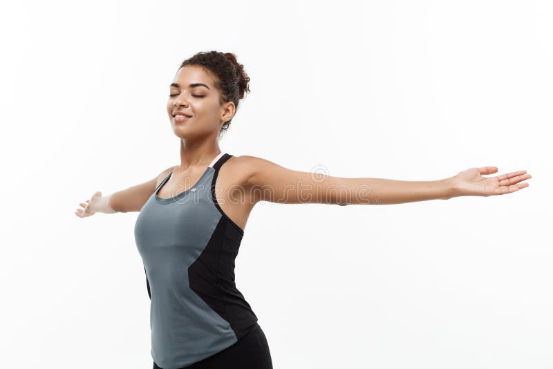 Healthy and Fitness concept - Portrait of young beautiful African American with her hands outstretched and closing eyes stock photography Healthy and Fitness concept - Portrait of young beautiful African American with her hands outstretched and closing eyes stock photography