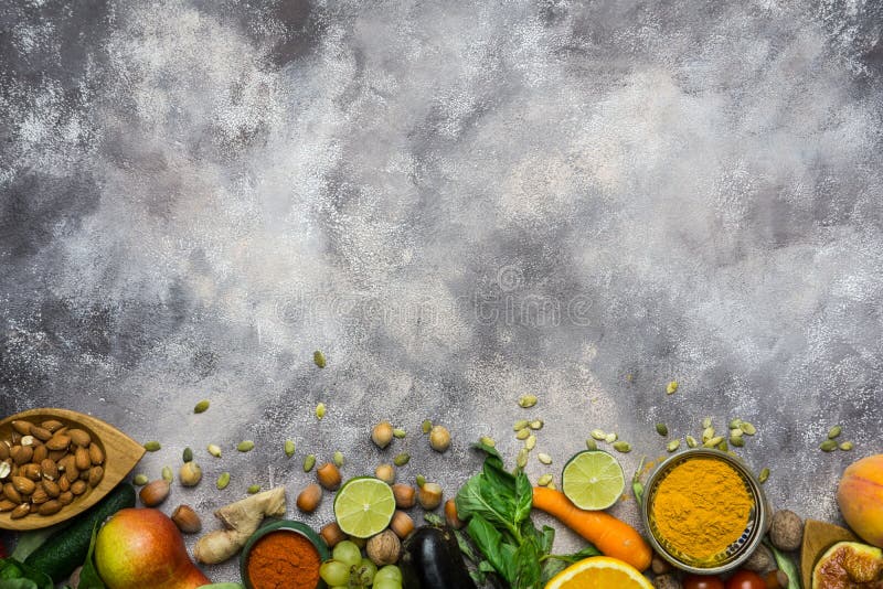 Healthy food background, frame of organic food. Ingredients for healthy cooking: vegetables, fruits, nuts, spices royalty free stock photography Healthy food background, frame of organic food. Ingredients for healthy cooking: vegetables, fruits, nuts, spices royalty free stock photography