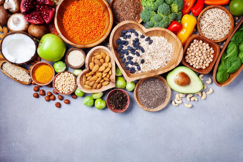 Healthy food background from fruits, vegetables, cereal, nuts and superfood. Dietary and balanced vegetarian eating products stock photos Healthy food background from fruits, vegetables, cereal, nuts and superfood. Dietary and balanced vegetarian eating products stock photos