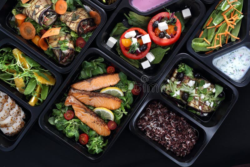 Lunch boxes, delicious and healthy dinner dishes. Food with delivery. Menu suggestions in catering with delivery. royalty free stock photo Lunch boxes, delicious and healthy dinner dishes. Food with delivery. Menu suggestions in catering with delivery. royalty free stock photo