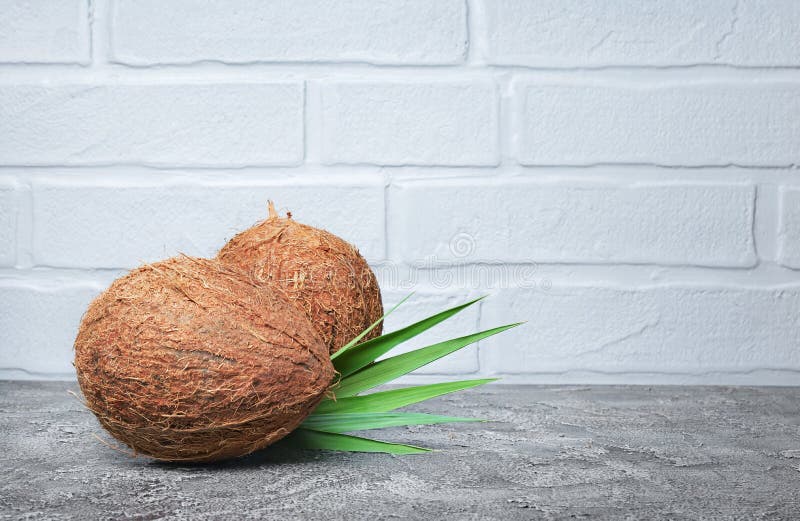 Healthy food. Fresh coconut with green palm leaves royalty free stock image Healthy food. Fresh coconut with green palm leaves royalty free stock image