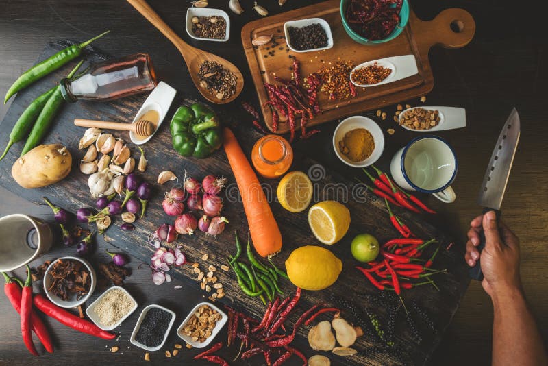 Healthy food herbs Spices for use as cooking ingredients on a wooden background with Fresh organic vegetables on wood. The concept stock image Healthy food herbs Spices for use as cooking ingredients on a wooden background with Fresh organic vegetables on wood. The concept stock image