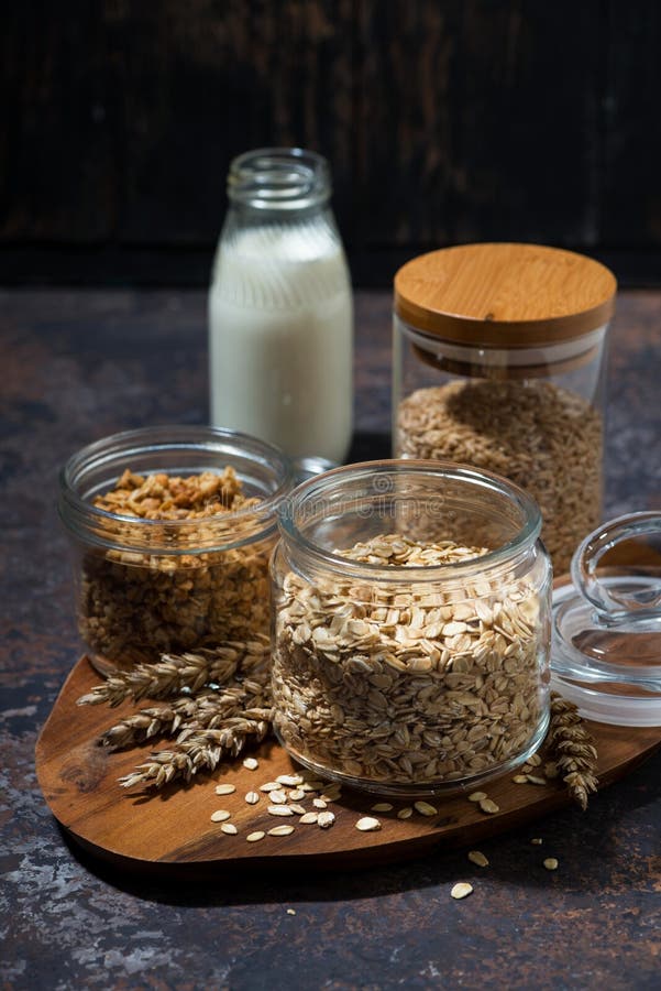 Healthy Foods - Homemade Granola and Milk on White Table, Vertical ...