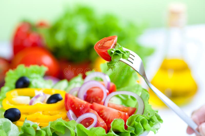 Healthy fresh vegetable salad and fork. Healthy fresh vegetable salad and fork