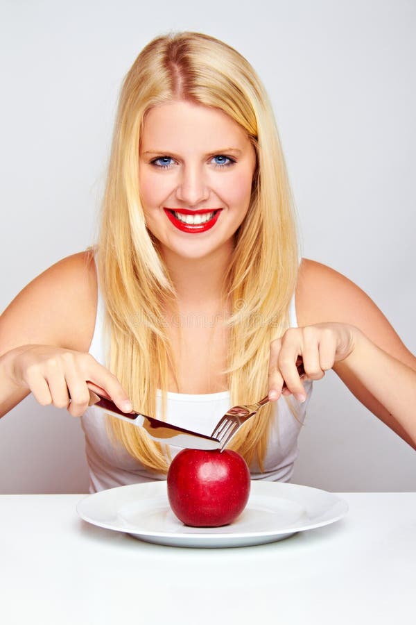 Healthy Girl eating an red apple