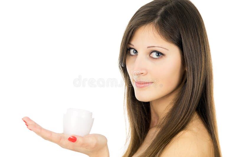 Healthy girl holding a cream