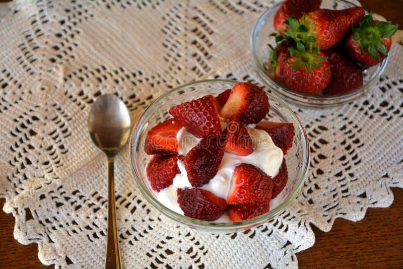 Healthy greek yogurt with chopped fresh strawberry for breakfast.