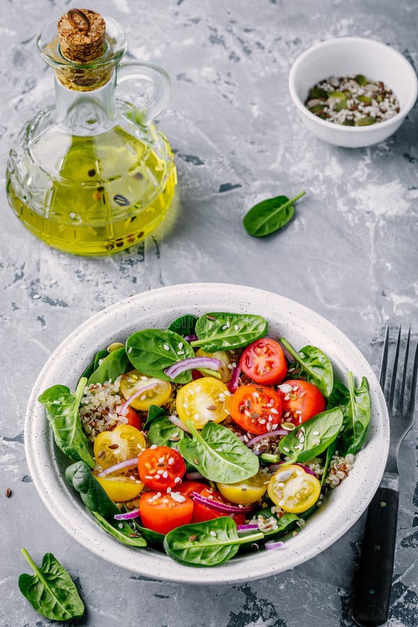 Healthy Green Salad with Spinach, Quinoa, Yellow and Red Tomatoes ...