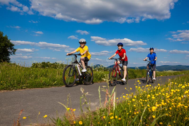 Active people - mother and kids biking. Active people - mother and kids biking