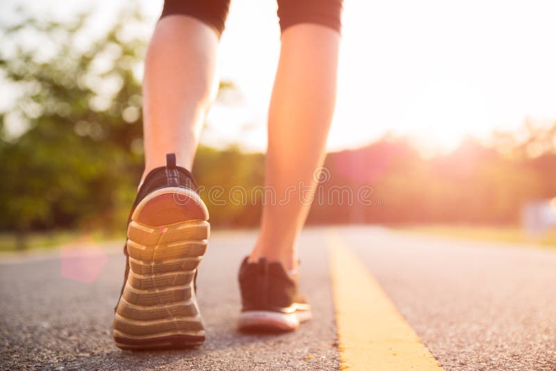 Healthy lifestyle sports woman legs running and walking