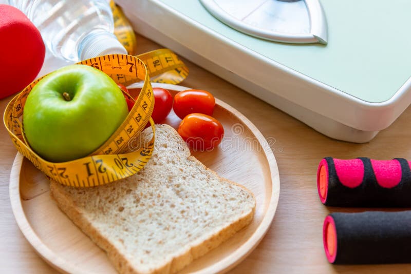 Healthy lifestyle for women diet weight scale with dumbbells sport equipment, sneakers, measuring tape, royalty free stock image Healthy lifestyle for women diet weight scale with dumbbells sport equipment, sneakers, measuring tape, royalty free stock image