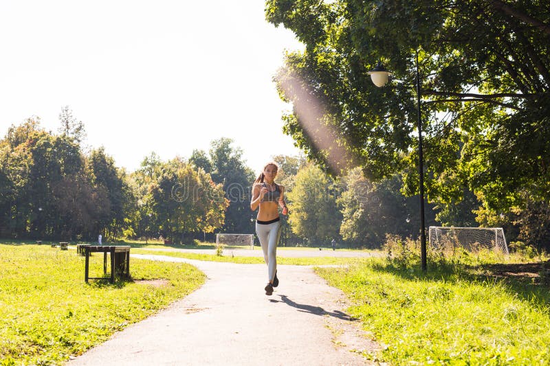 Healthy lifestyle young fitness woman running outdoors