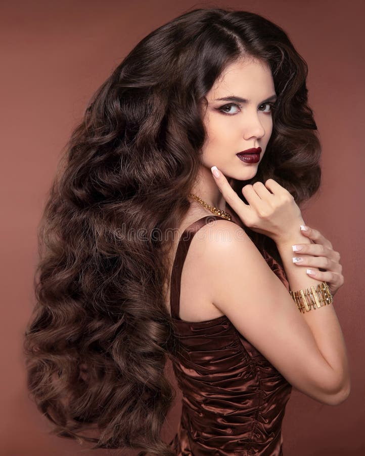 Healthy long hair. Beautiful girl. Hairstyle. Makeup. Elegant br