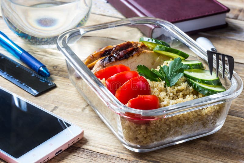 Healthy Meal Prep Containers with Quinoa, Chicken and Arugula Stock