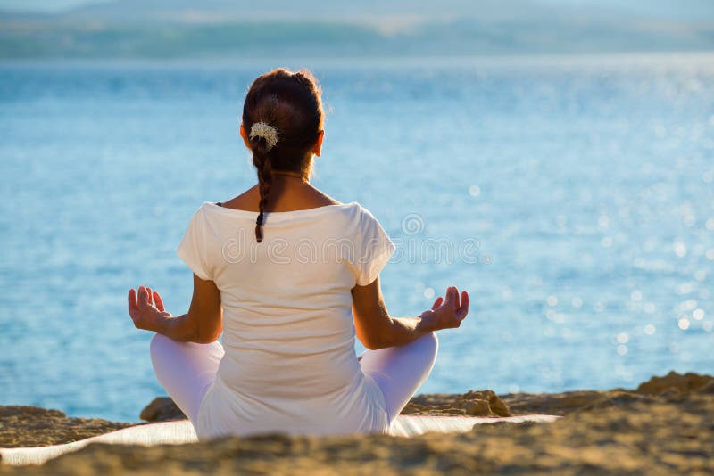 Healthy middle aged woman doing fitness stretching outdoors